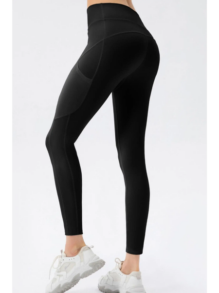 Trendsi black compression slim fit workout pants for women modeled with white sneakers
