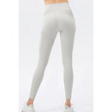 Trendsi white compression slim fit workout pants for women shown from the back with high waist design