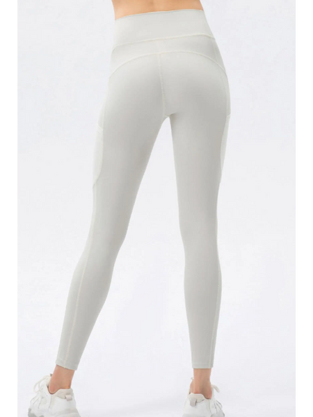 Trendsi white compression slim fit workout pants for women shown from the back with high waist design