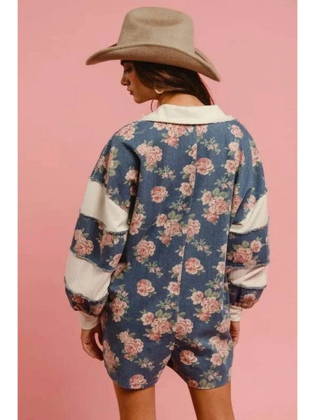 Babe Beachwear floral contrast collar summer romper with long sleeves and beige hat on model