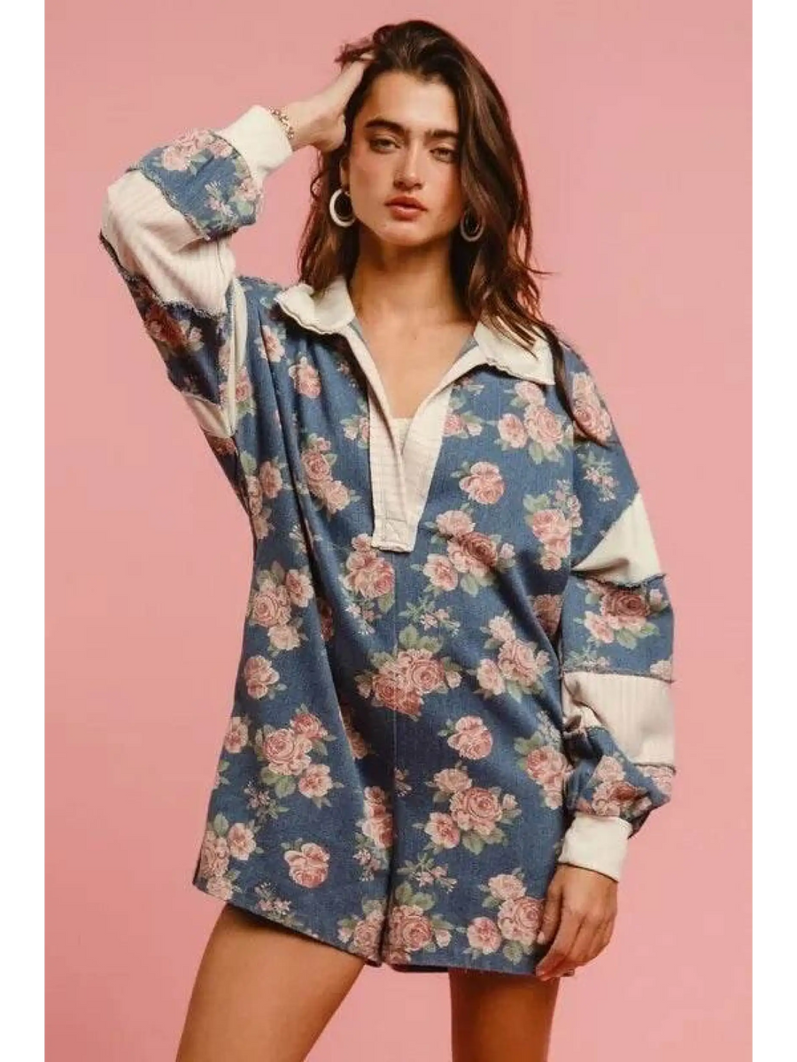 Babe Beachwear contrast collar summer romper with blue floral print and white trim on model