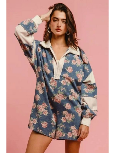 Babe Beachwear contrast collar summer romper with blue floral print and white trim on model