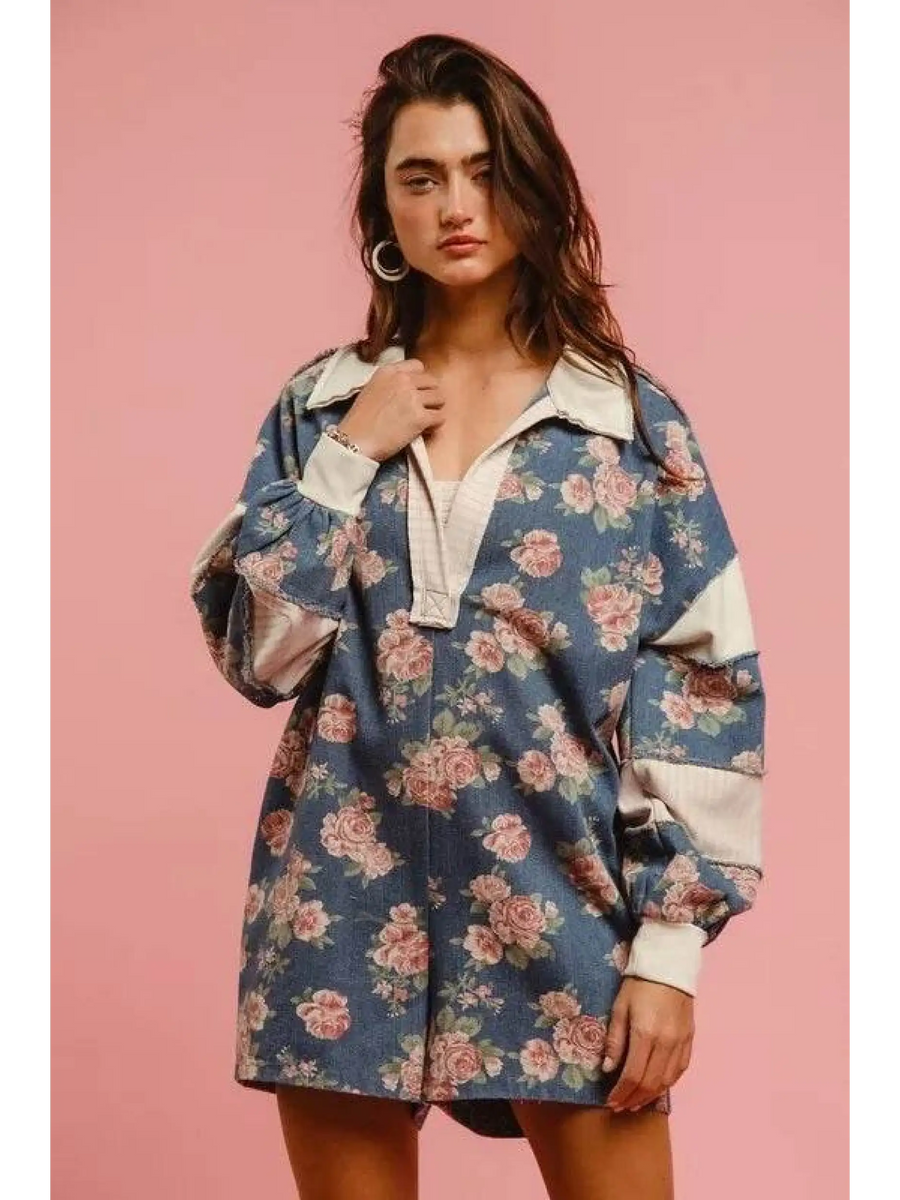 Woman wearing a Babe Beachwaer floral contrast collar summer romper with long sleeves and relaxed fit
