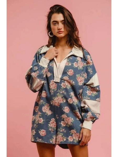 Woman wearing a Babe Beachwaer floral contrast collar summer romper with long sleeves and relaxed fit