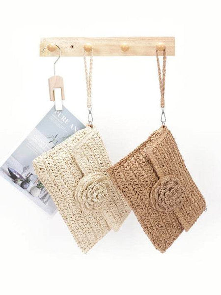 Babe Beachwear convertible straw purse for women in natural and tan colors hanging on wooden hooks