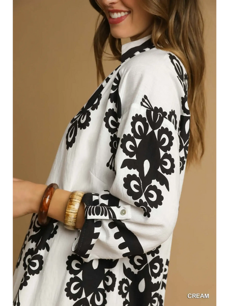 Trendsi cream long sleeve resort tunic dress with black floral print and buttoned cuffs