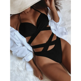 Beach Babes black crisscross halter neck bikini on model with white cover-up and wide-brim hat