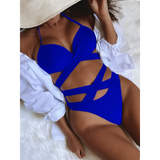 Beach Babes blue crisscross halter neck bikini with stylish cutouts on model reclining