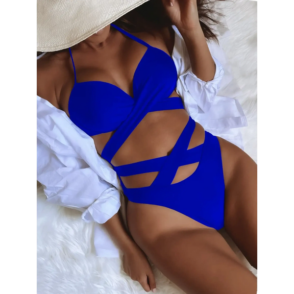 Beach Babes blue crisscross halter neck bikini with stylish cutouts on model reclining
