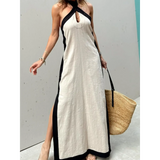 Trendsi crisscross maxi dress for women in beige with black trim and side slits styled with a straw tote