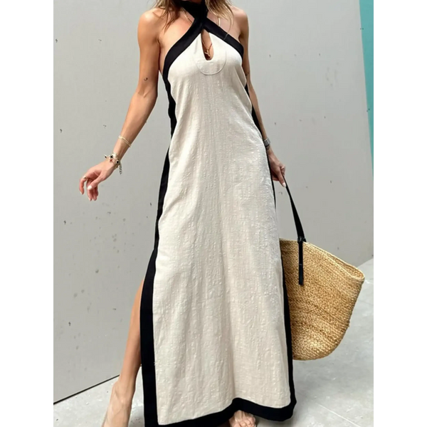 Trendsi crisscross maxi dress for women in beige with black trim and side slits styled with a straw tote