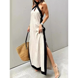 Trendsi crisscross maxi dress for women in beige with black trim and side slit, styled with a woven handbag
