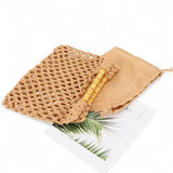 Artini Accessories crochet bamboo handle clutch in natural color with a protective beige pouch