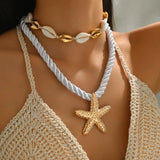 Trendsi cruise wear beaded rope necklace with gold starfish pendant and seashell choker on model