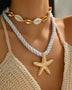 Trendsi cruise wear beaded rope necklace with gold starfish pendant and seashell choker on model