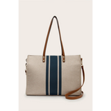 Cruise Wear Striped Tote Bag with beige fabric and vertical navy blue stripes with brown leather straps