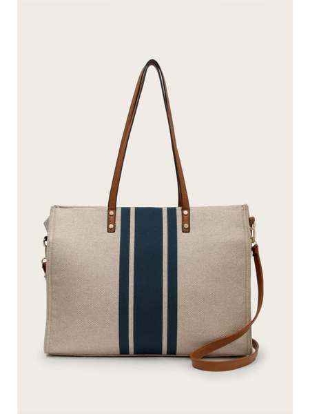 Cruise Wear Striped Tote Bag with beige fabric and vertical navy blue stripes with brown leather straps