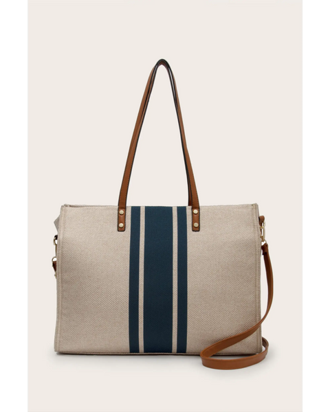 Cruise Wear Striped Tote Bag with beige fabric and vertical navy blue stripes with brown leather straps