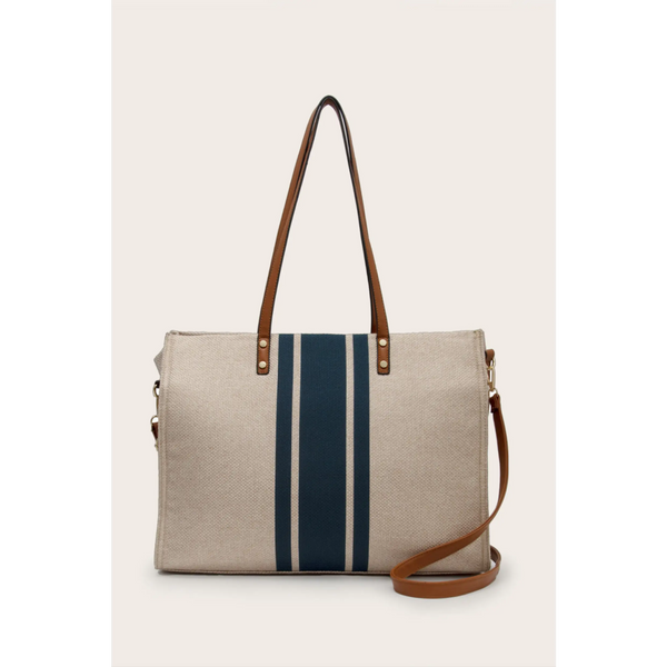 Cruise Wear Striped Tote Bag with beige fabric and vertical navy blue stripes with brown leather straps