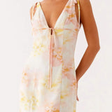 Babe Beachwear mini dress with pastel floral print and tie front detail, perfect cute beach dresses for petites