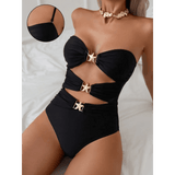 Beach Babes black cutout one piece swimsuit with gold buckle accents and strapless design
