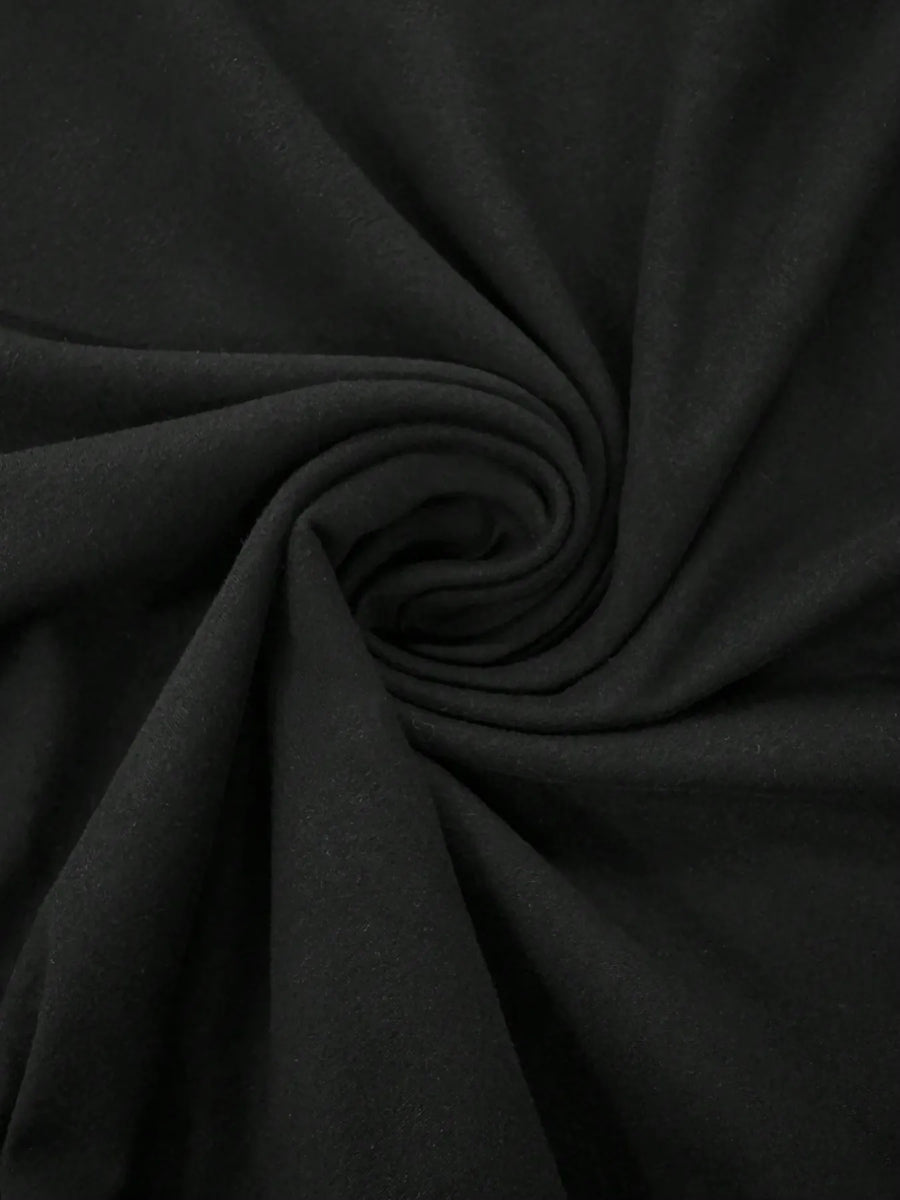 Close-up of black fabric swirl for Trendsi mini dress showcasing soft and smooth material texture
