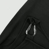 Close-up of black mini dress strap with silver metal ring detail from Trendsi