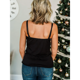 Trendsi black tank top dressy summer cami for beachwear worn by woman with blonde hair in front of decorated Christmas tree