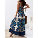 Trendsi Earth Toned Tropical Jumpsuit featuring wide-leg pants and a bold blue and brown pattern