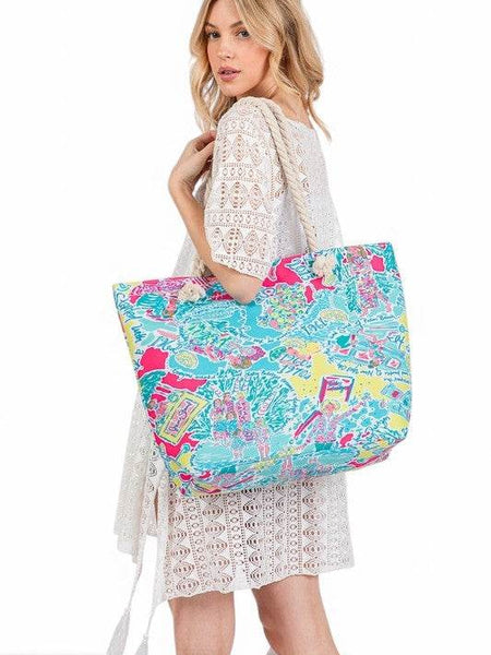 Babe Beachwear colorful easy to pack summer beach bag carried by woman in white lace dress