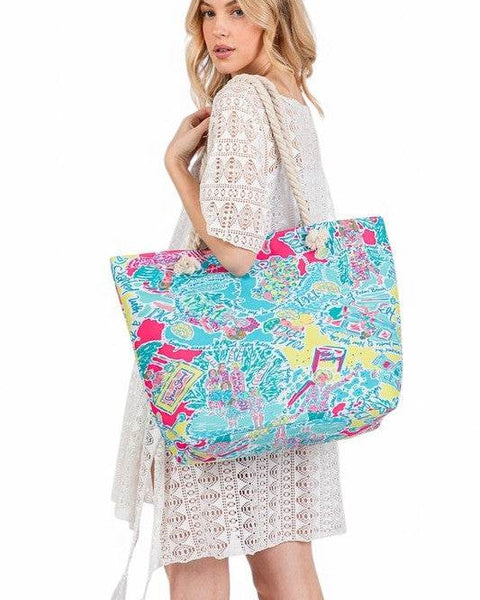 Babe Beachwear colorful easy to pack summer beach bag carried by woman in white lace dress