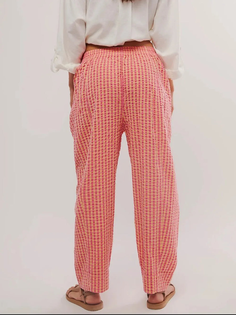 Trendsi pink elastic waist beach pants with a relaxed fit shown from the back