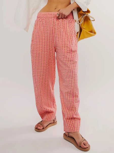Trendsi pink checkered elastic waist beach pants worn with sandals for casual summer look