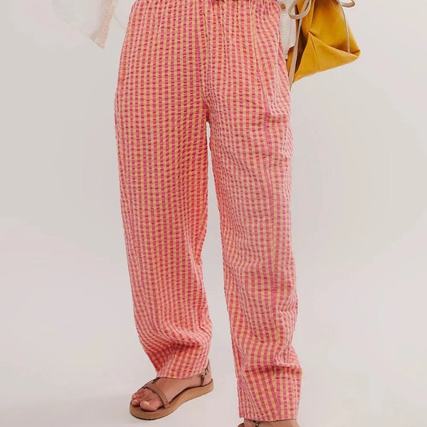 Trendsi pink checkered elastic waist beach pants worn with sandals for casual summer look