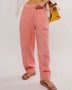 Trendsi pink checkered elastic waist beach pants worn with sandals for casual summer look