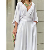 Babe Beachwear elegant wide-leg beachwear jumpsuit in white with deep V-neck and loose sleeves