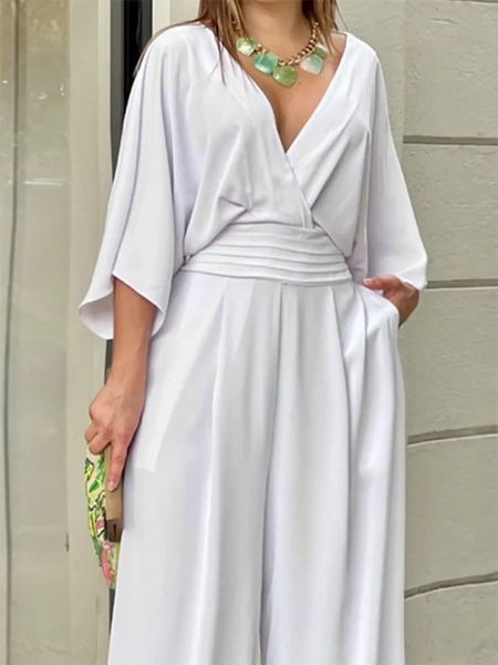 Babe Beachwear elegant wide-leg beachwear jumpsuit in white with deep V-neck and loose sleeves