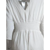 Babe Beachwear elegant wide-leg beachwear jumpsuit in white with cinched waist and long sleeves