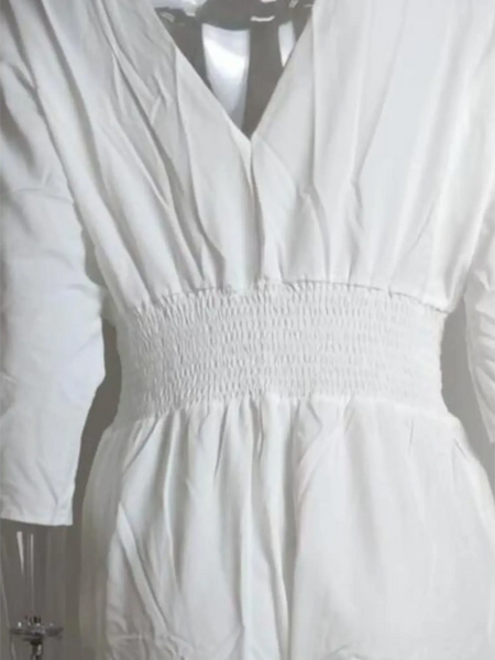 Babe Beachwear elegant wide-leg beachwear jumpsuit in white with cinched waist and long sleeves
