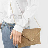 Babe Beachwear Evening Clutch Rhinestones gold envelope bag with chain strap worn on model