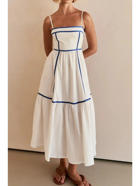 woman wearing white contrast trim midi dress with blue piping and spaghetti straps