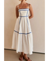 woman wearing white contrast trim midi dress with blue piping and spaghetti straps