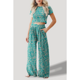Turquoise crop top pants set with abstract print featuring short sleeve crop top and wide-leg pants