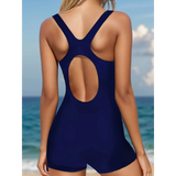 Trendsi navy blue figure flattering swimsuit for women with racerback and cutout back design by the ocean