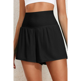 Beach Babes black swim shorts designed as flattering swimsuit bottoms with pockets and a high waist