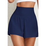 Beach Babes navy blue swim shorts as flattering swimsuit bottoms with pockets and high waist design