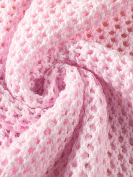Close-up of pink crochet fabric showing detailed texture of floral mesh beach sweater by Trendsi