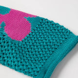 Close-up of a Trendsi crochet top sleeve in teal with a pink floral mesh beach sweater pattern