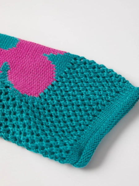 Close-up of a Trendsi crochet top sleeve in teal with a pink floral mesh beach sweater pattern