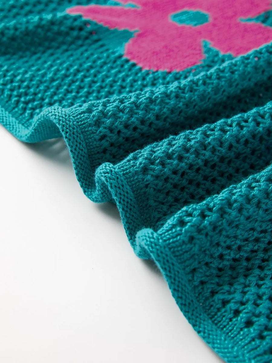 Close-up of teal floral mesh beach sweater crochet top with pink flower detail by Trendsi